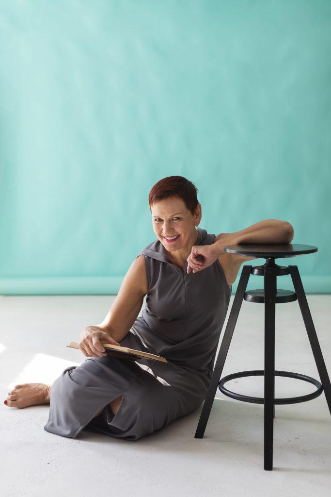 mature pretty woman sitting stool